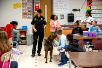 Willow visiting the kids at school in a classroom.